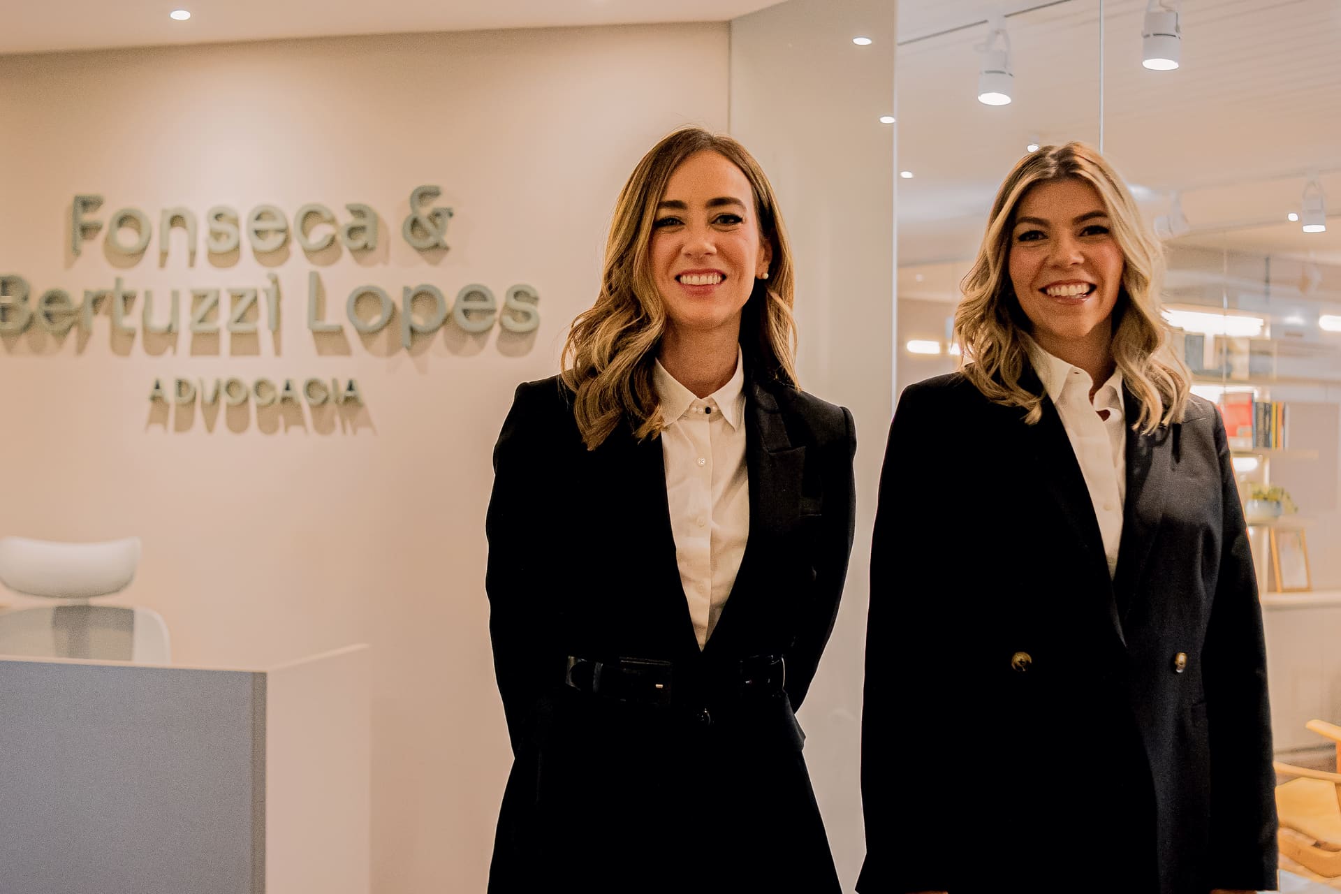 Maíra S. Marques da Fonseca and Thayana Bertuzzi Lopes, founding partners of Fonseca & Bertuzzi Lopes Advocacia, at the firm's reception in Curitiba